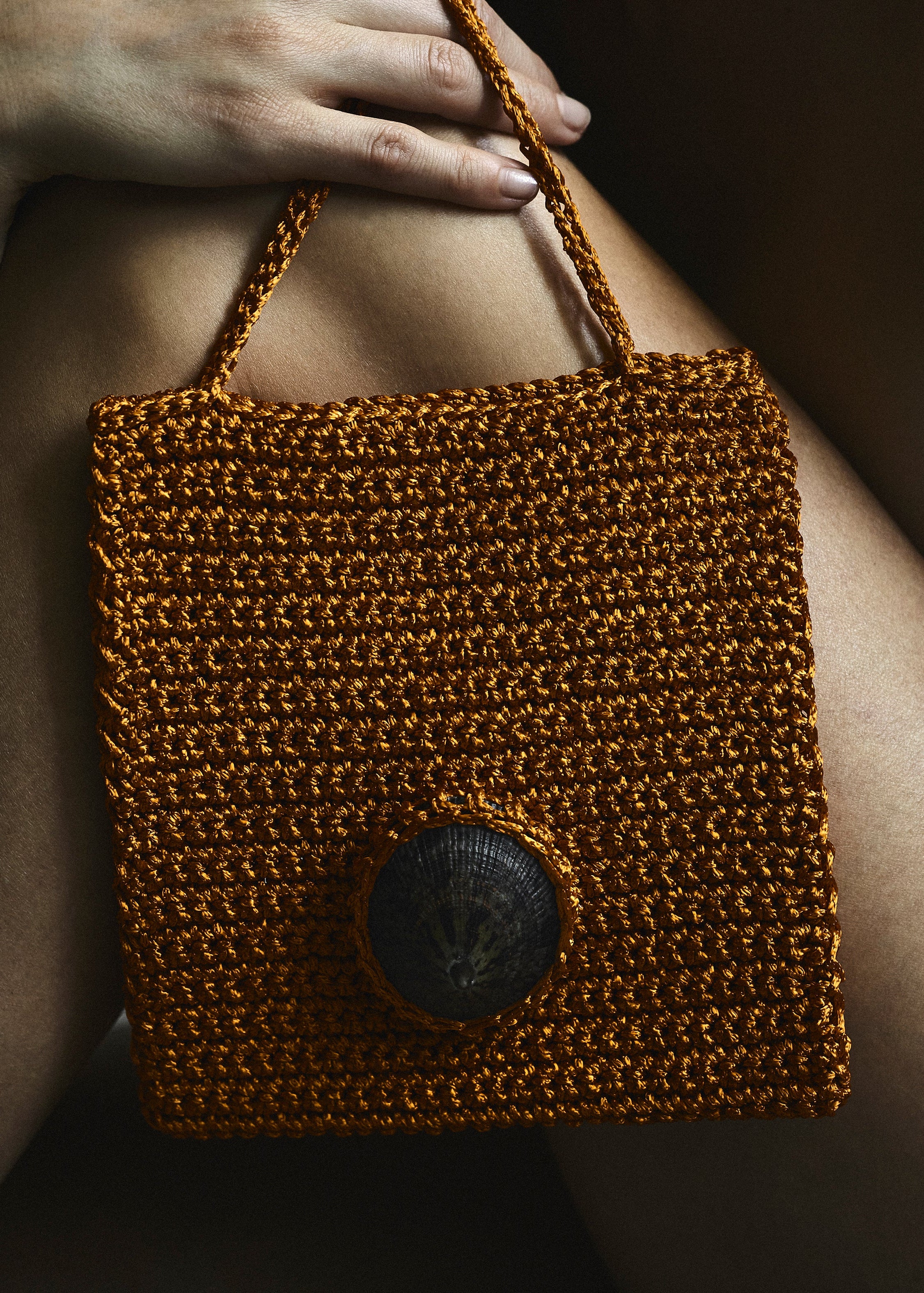 Handmade crochet bag with seashell adornment 