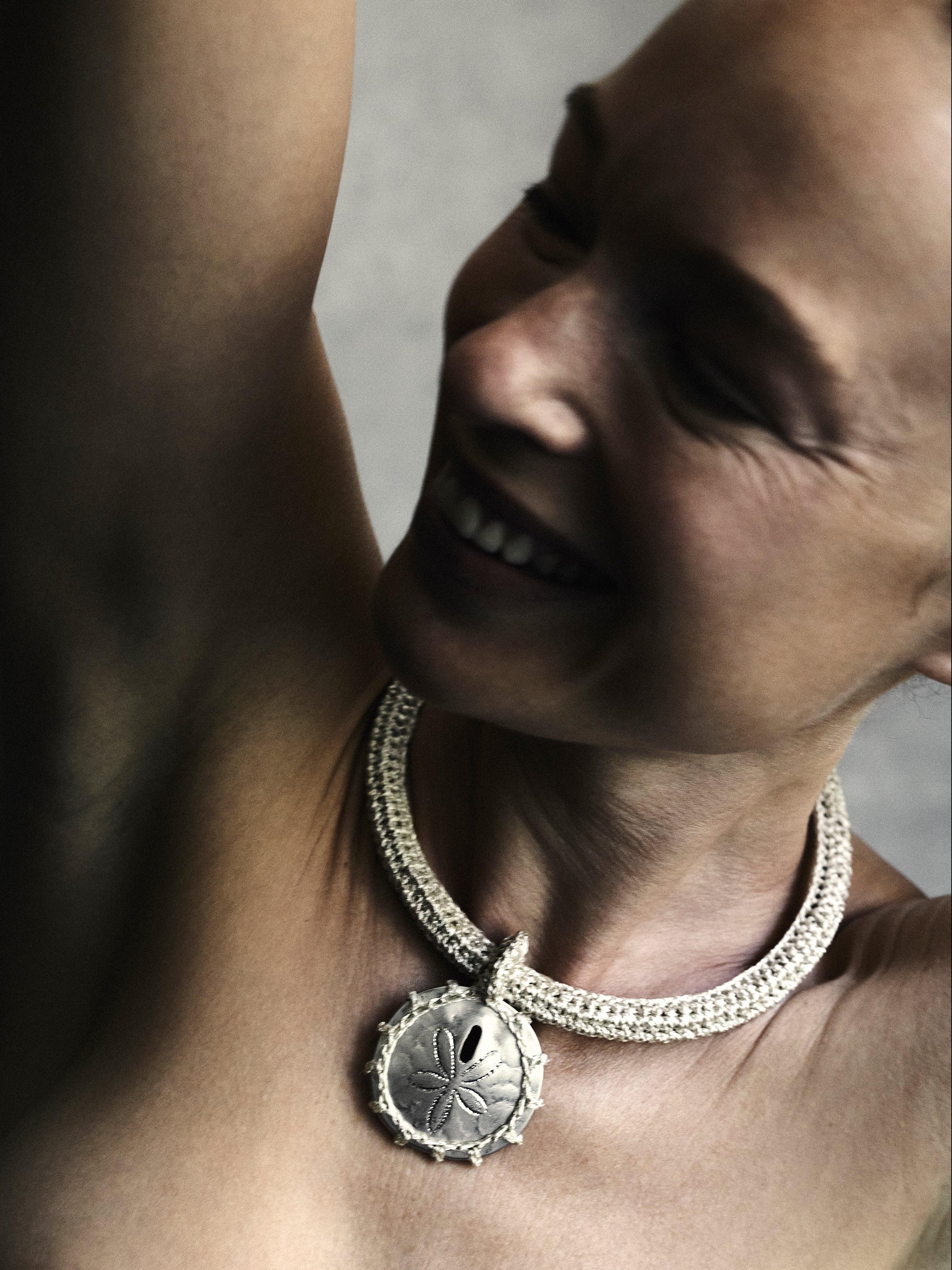 Hand crocheted choker necklace with bronze cast sand dollar pendant