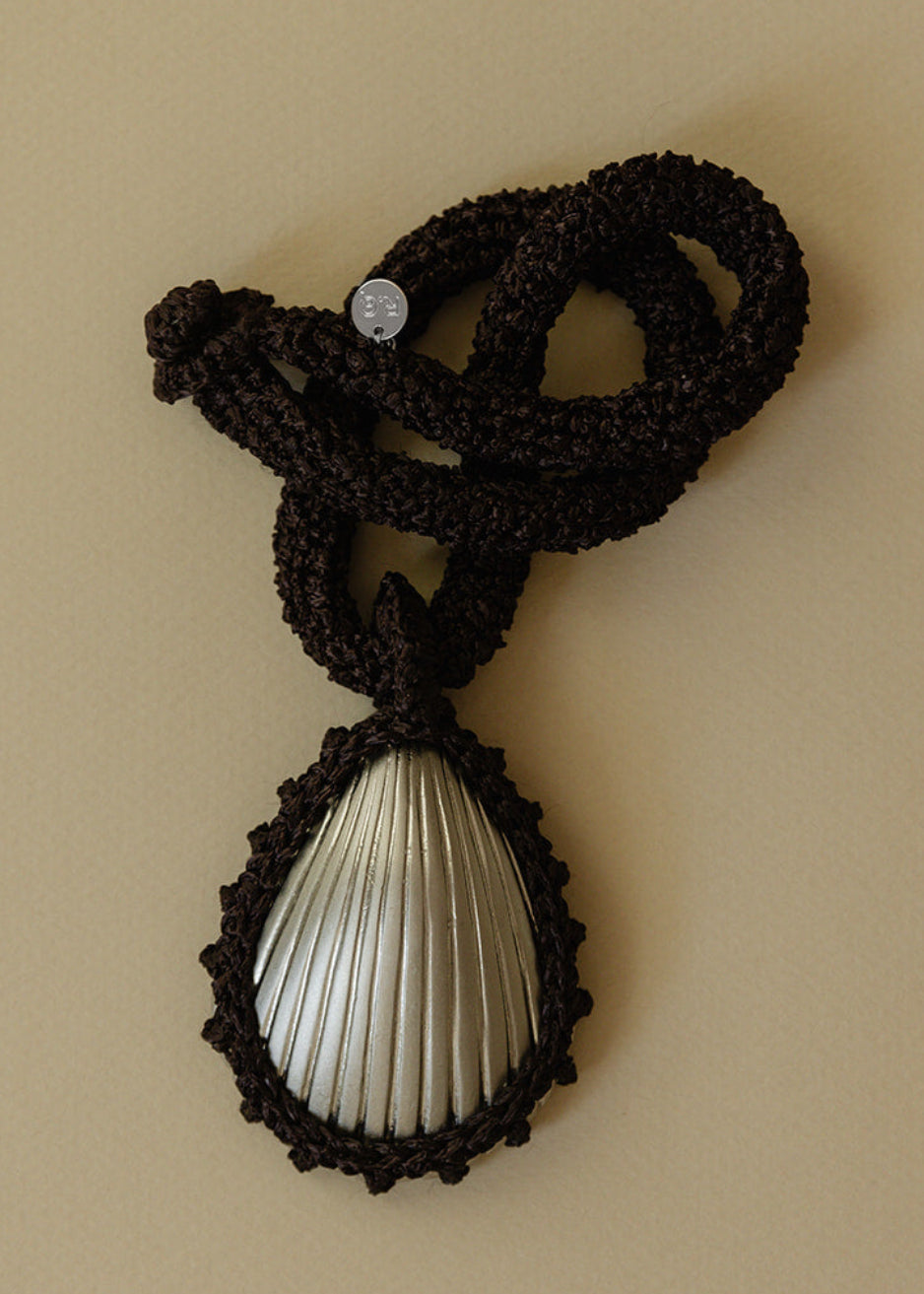 Hand crocheted necklace with a silver-plated bronze seashell pendant