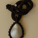 Hand crocheted necklace with a silver-plated bronze seashell pendant
