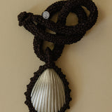 Hand crocheted necklace with a silver-plated bronze seashell pendant