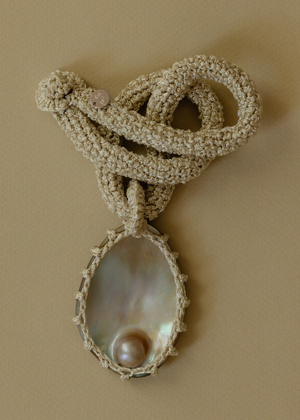 Hand crocheted necklace with blister pearl pendant
