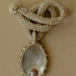 Hand crocheted necklace with blister pearl pendant