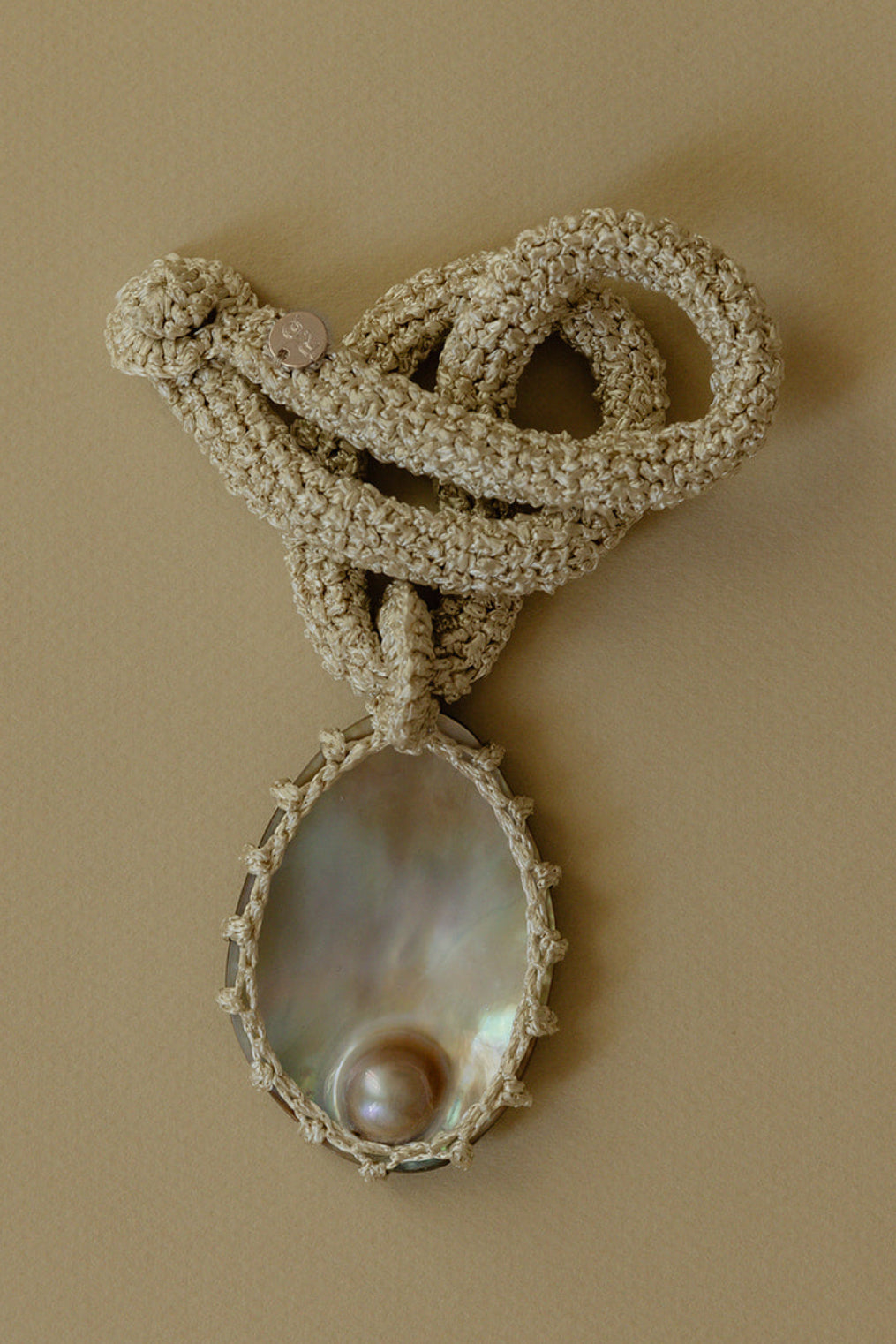 Hand crocheted necklace with blister pearl pendant