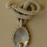 Hand crocheted necklace with blister pearl pendant
